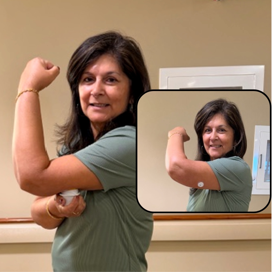 Picture of a person wearing a continuous glucose monitor